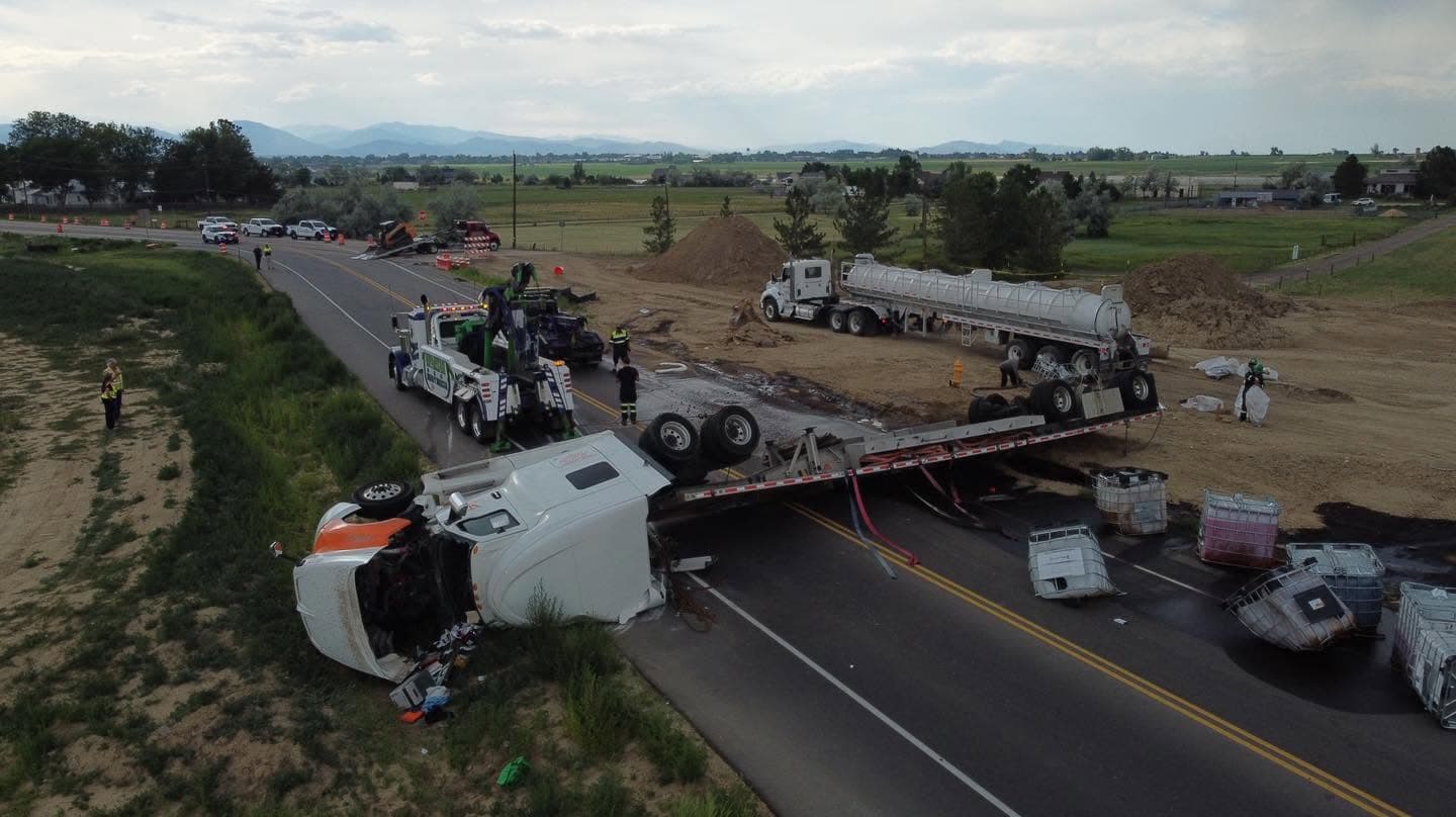 Aerial view of a highway recovery with an overturned tanker