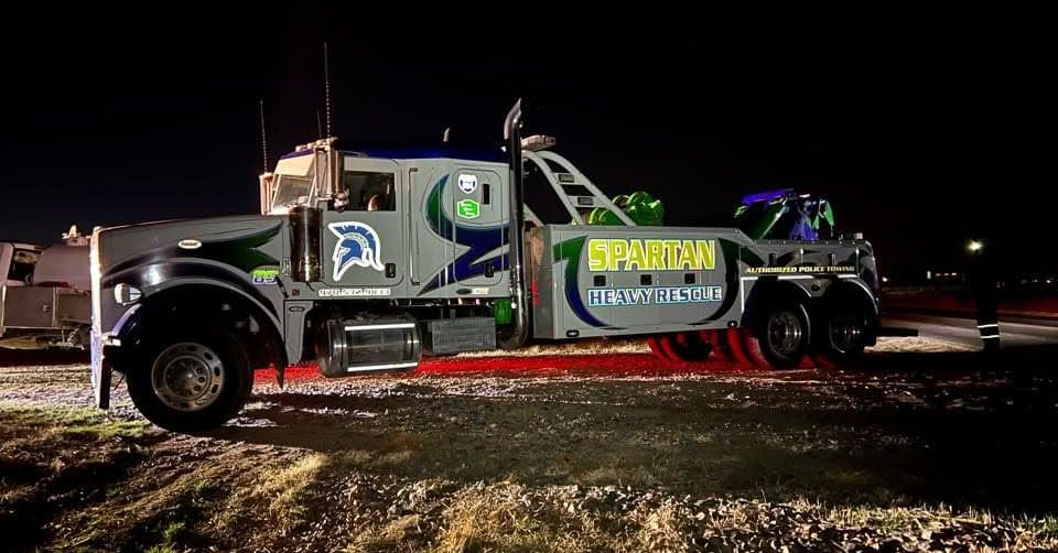Decorated heavy-duty Spartan wrecker photographed at night